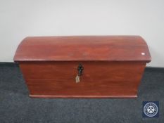An antique painted oak dome top trunk