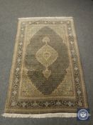** Withdrawn ** A Tabriz design rug,