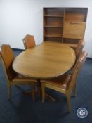A six piece 20th century teak dining room suite comprising of oval extending dining table,