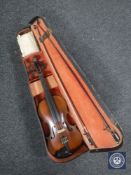 An early 20th century violin and two bows in case CONDITION REPORT: 14