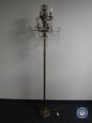 A contemporary metal standard lamp
