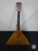 A three-stringed balalaika