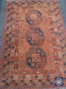 Turkmen rug, North Afghanistan, the terracotta field with three elephant foot guls,