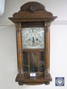 A continental cased eight day wall clock with silvered dial