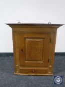 A continental oak wall cabinet fitted a drawer