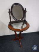 A contemporary occasional table and dressing table mirror