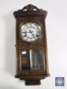 A President 31 day wall clock with pendulum and key