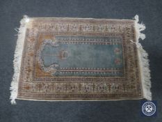 A Kayseri prayer rug, Anatolia, on turquoise ground with cream borders,