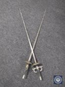 A pair of fencing foils