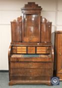 A continental mahogany cylinder bureau bookcase,