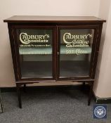An Edwardian and later inlaid mahogany display cabinet with 