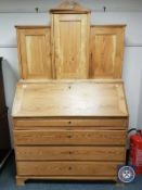 A 19th century continental pine bureau cabinet,