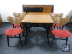 A mid 20th century teak G Plan dining room suite