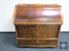 A continental mahogany barrel fronted bureau