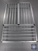 Three stainless steel catering racks