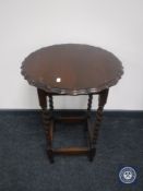 An oak pie crust edged occasional table
