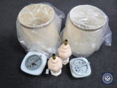 A box containing two light fittings with opaque glass shades, two pottery table lamps,