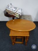 A nest of three tables, a drum table,