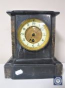 A Victorian slate brass mantel clock with brass and enamelled dial