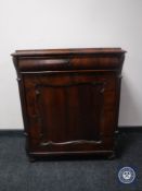 A continental mahogany cabinet fitted with a drawer