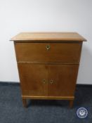 An oak cocktail cabinet