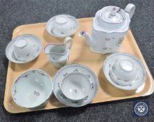 A Newhall porcelain teapot and cover, circa 1790, of commode form, puce mark to underside,