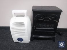 An electric coal effect fire and a de-humidifier