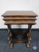 A nest of three oak tables