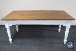 A pine farmhouse kitchen table on painted base