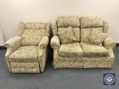 A two seater settee upholstered in floral fabric and an electric reclining armchair