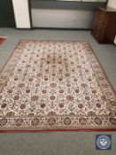 A machine made carpet of oriental design,