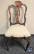 A 19th century Dutch mahogany chair with marquetry inlay
