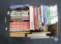 A box of football annuals,