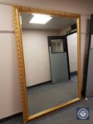 A large ornate bevelled framed mirror,