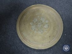 An Eastern brass plaque