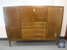 A mid 20th century walnut cocktail sideboard
