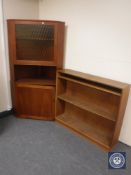 A mid 20th century teak corner cabinet and set of bookshelves