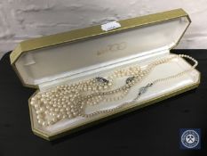 Three simulated pearl necklaces