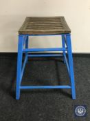 A 20th century teak seated metal stool