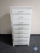 A mid 20th century painted narrow eight drawer chest