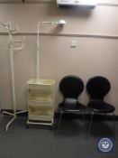 A pair of black leather dining chairs on chrome legs, hair dressers trolley,