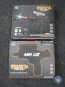 Two boxed Regimental Police mini Uzi water pistols