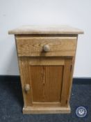 A pine bedside cabinet fitted a drawer