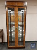 A 20th century Chinese illuminated, glazed and mirrored display cabinet,