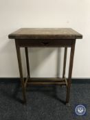 An oak foldover top games table