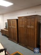 A carved oak linen fold three piece bedroom suite