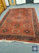 A machine made carpet of Persian design,