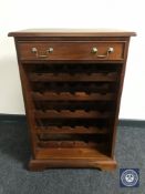 An Indonesian mahogany wine cabinet fitted a drawer
