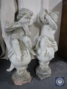 A pair of 20th century cherub finials