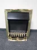A brass fronted coal effect electric fire